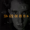 Small image of a man's face in black and white, the numbers 4 8 15 16 23 and 42 are imposed backwards over the photo.