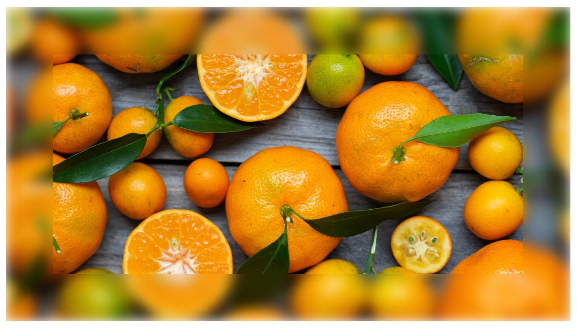 Screenshot of an element with a background image that shows oranges on a wooden table. The border of this element is blurred.